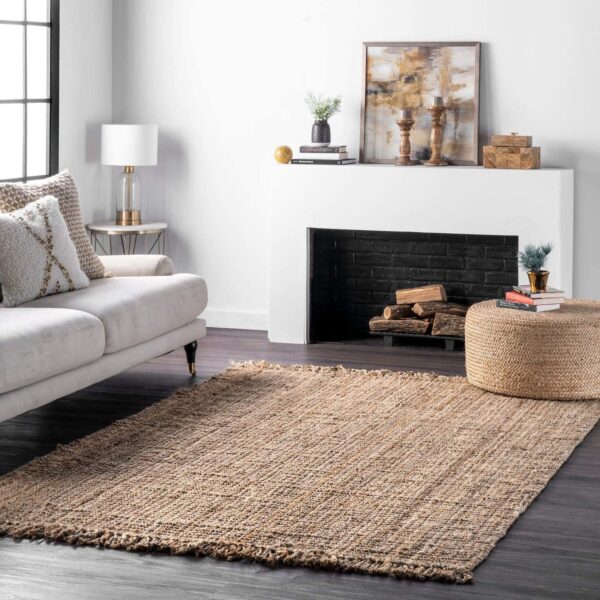 Handmade chunky jute rug with a thick natural fiber weave, styled in a cozy living room with boho-chic décor and wooden accents